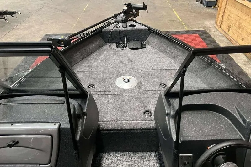 Slide: The Image of 2026 Tracker Pro Guide V-16 WT boat interior with fishing deck and steering console. - 5