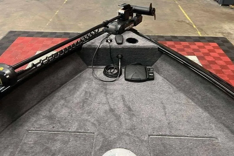 Slide: The Image of 2026 Tracker Pro Guide V-16 WT boat interior with trolling motor and foot pedal. - 9