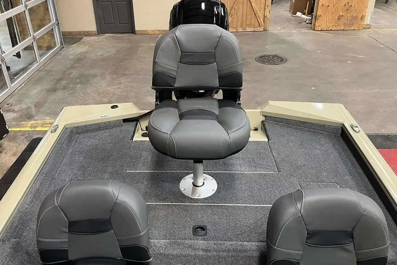 Slide: The Image of 2026 Tracker Pro Team 175 boat interior with gray seating and carpeted deck. - 6