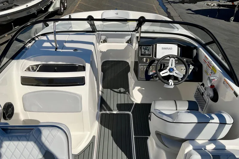Slide: The Image of 2026 Bayliner VR6 Bowrider I/O interior with steering wheel and dashboard controls. - 10