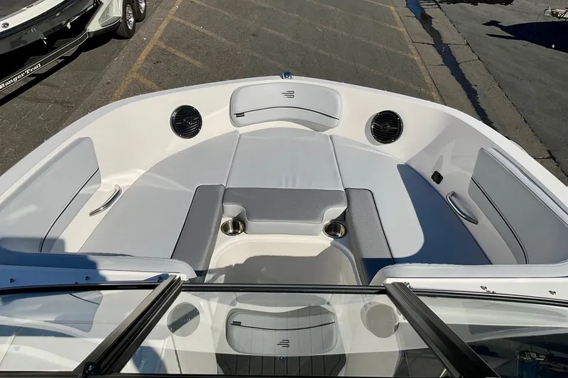 Slide: The Image of 2026 Bayliner VR6 Bowrider I/O boat interior with spacious seating and cup holders. - 12