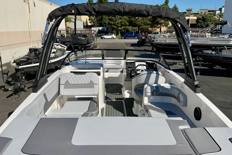 Slide: The Image of 2026 Bayliner VR6 Bowrider I/O boat interior with seating and steering wheel. - 15