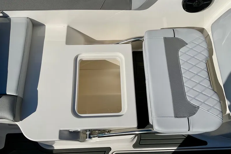 Slide: The Image of 2026 Bayliner VR6 Bowrider I/O interior seating with storage compartment. - 18