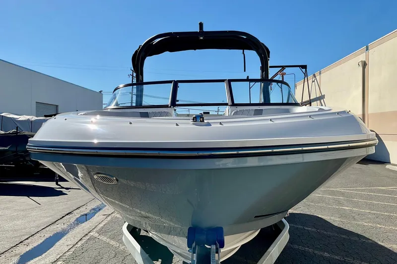 Slide: The Image of 2026 Bayliner VR6 Bowrider I/O boat in a parking lot, front view. - 7