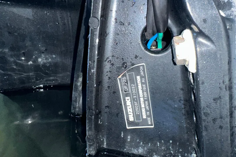 Slide: The Image of Close-up of Suzuki DF225 engine label on 2005 Regulator 26 Center Console boat. - 12