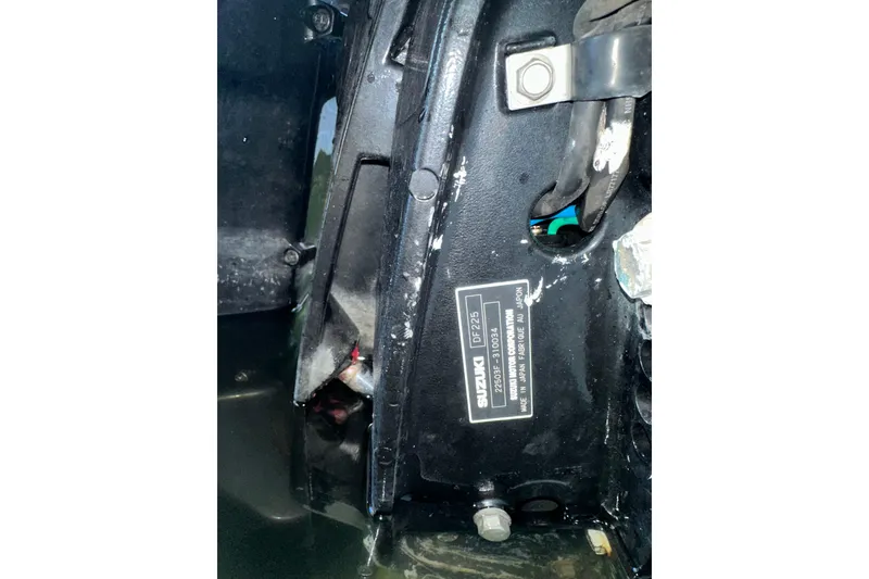 Slide: The Image of Close-up of Suzuki DF225 engine part on 2005 Regulator 26 Center Console boat. - 13