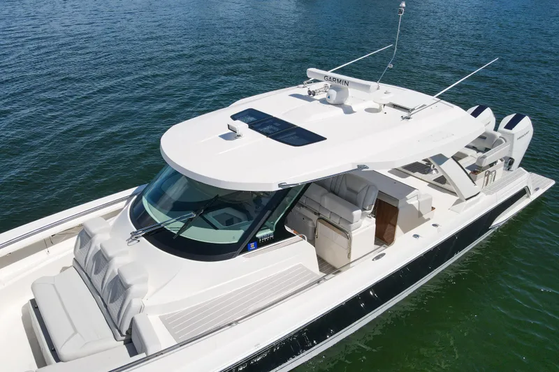 Slide: The Image of 2024 Tiara Yachts 43 LS luxury boat on water, featuring sleek design and modern amenities. - 11