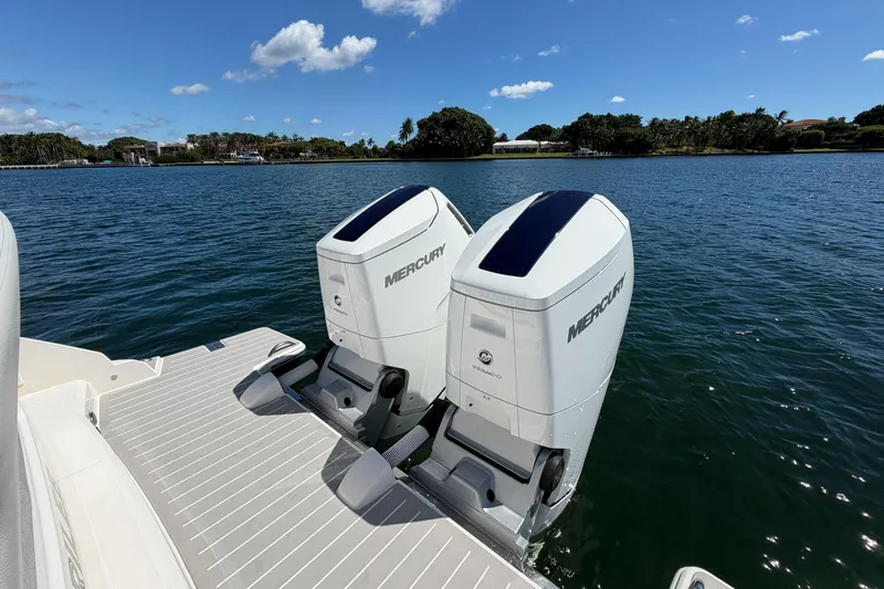 Slide: The Image of 2024 Tiara Yachts 43 LS with twin Mercury outboard engines on a sunny day. - 15