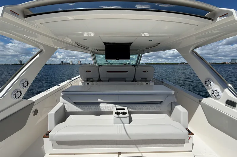Slide: The Image of 2024 Tiara Yachts 43 LS interior with luxurious seating and ocean view. - 19