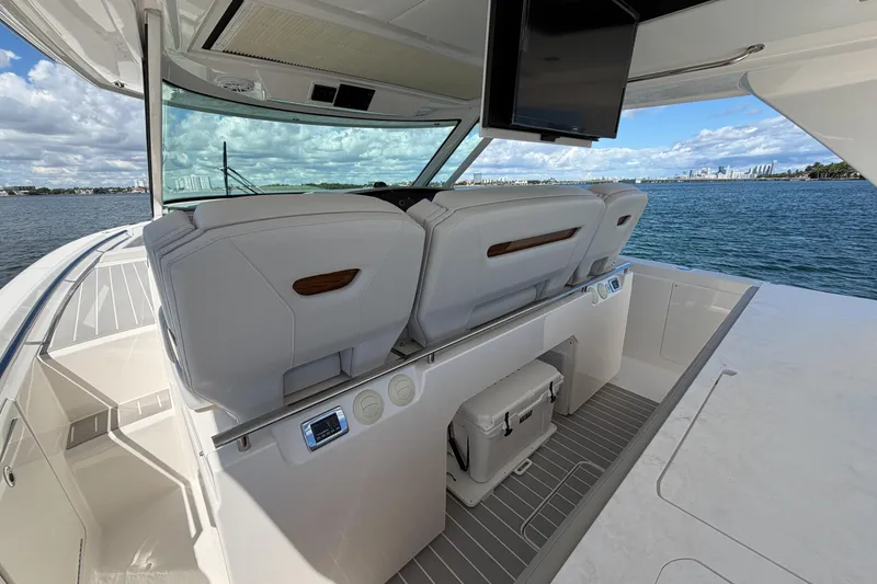 Slide: The Image of 2024 Tiara Yachts 43 LS interior with luxurious seating and ocean view. - 23