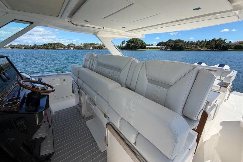 Slide: The Image of 2024 Tiara Yachts 43 LS interior with luxurious seating and scenic water view. - 24