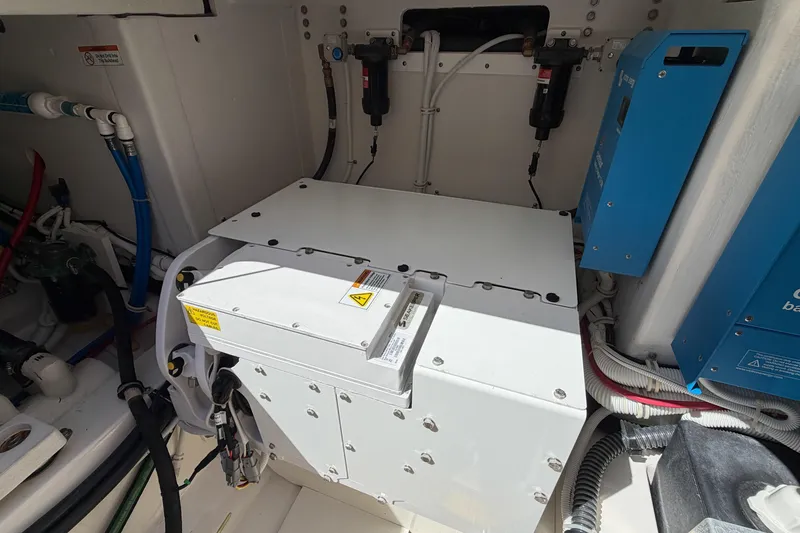 Slide: The Image of Engine compartment of 2024 Tiara Yachts 43 LS, showcasing electrical components and wiring. - 39