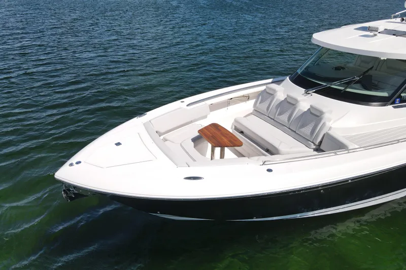 Slide: The Image of 2024 Tiara Yachts 43 LS luxury boat on calm water. - 5