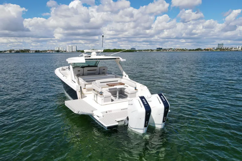 Slide: The Image of 2024 Tiara Yachts 43 LS on calm water, showcasing luxury design and powerful engines. - 9