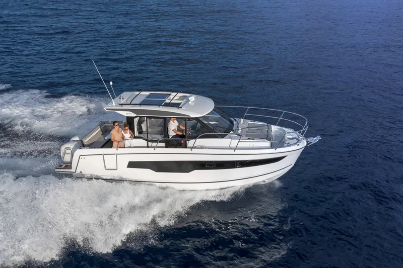 Slide: The Image of 2026 Jeanneau NC 895 Series 2 cruising on open water with passengers onboard. - 3