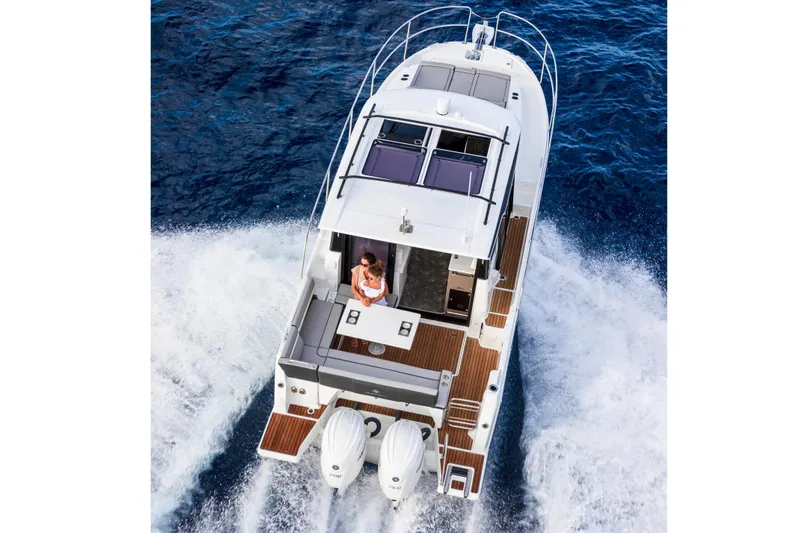 Slide: The Image of 2026 Jeanneau NC 895 Series 2 cruising on open water, aerial view. - 4