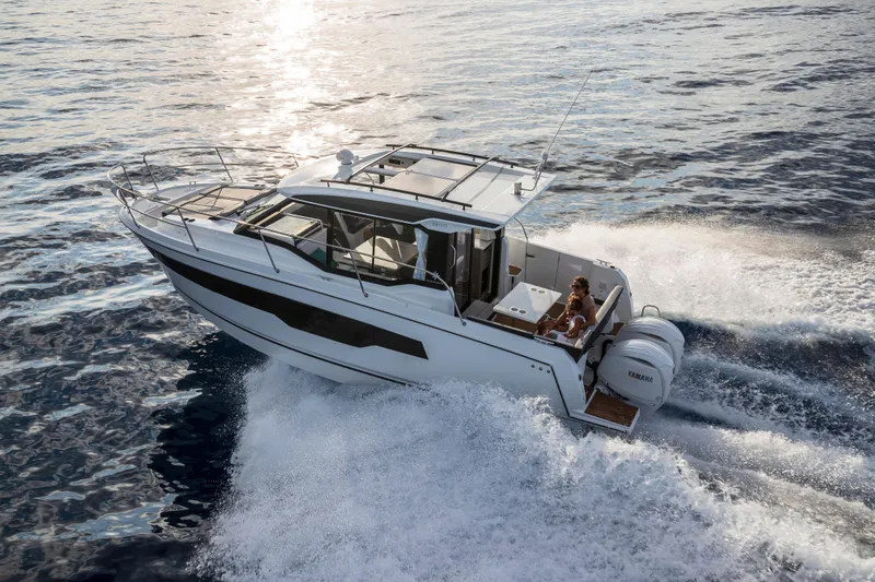 Slide: The Image of 2026 Jeanneau NC 895 Series 2 cruising on open water, showcasing sleek design and powerful engines. - 6