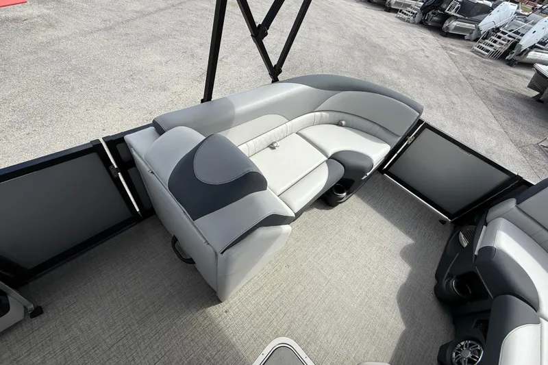 Slide: The Image of 2025 Avalon 2385 LSZ Quad Lounger interior with gray seating and spacious layout. - 13