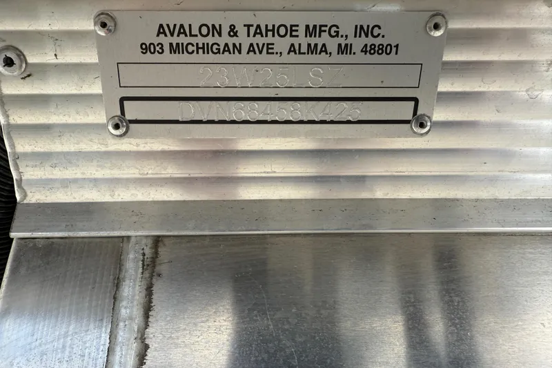 Slide: The Image of Metal plate displaying Avalon & Tahoe manufacturing details and serial number. - 22