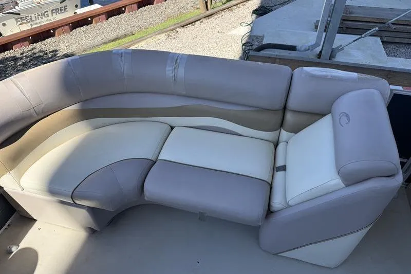 Slide: The Image of 2013 Crest Classic 230 SLC boat seating with beige and cream upholstery. - 10