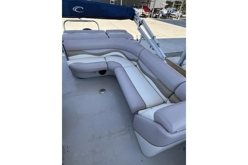 Slide: The Image of 2013 Crest Classic 230 SLC boat with spacious, cushioned seating area. - 25