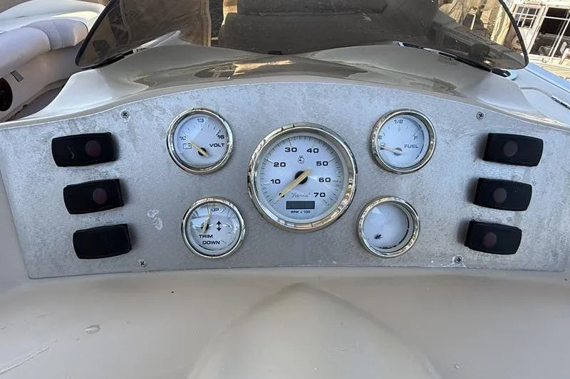 Slide: The Image of Dashboard of 2013 Crest Classic 230 SLC boat with gauges and controls. - 29