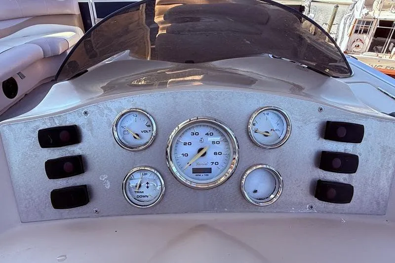 Slide: The Image of Dashboard of a 2013 Crest Classic 230 SLC boat with gauges and controls. - 31