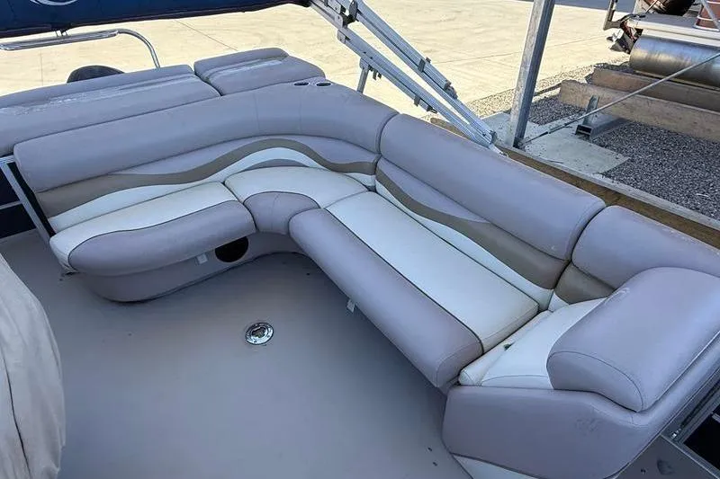 Slide: The Image of 2013 Crest Classic 230 SLC boat interior with plush seating and elegant design. - 8