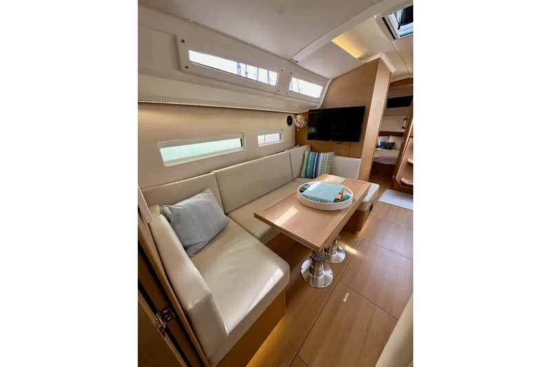 Slide: The Image of 2024 Jeanneau Sun Odyssey 410 interior with cozy seating and modern design. - 114