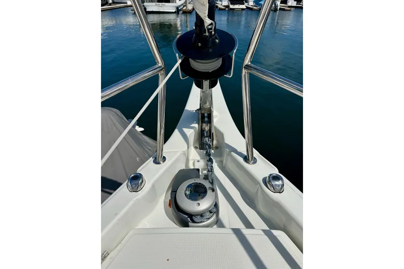 Slide: The Image of Bow of 2024 Jeanneau Sun Odyssey 410 sailboat with anchor chain and winch. - 56