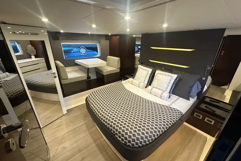 Slide: The Image of Luxurious interior of 2023 Schaefer 660 yacht with modern bedroom and dining area. - 11