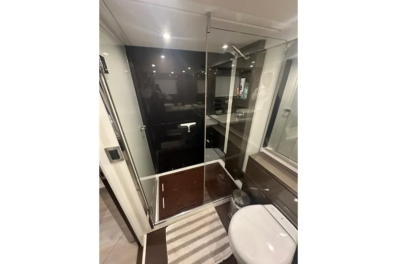 Slide: The Image of Luxurious bathroom in 2023 Schaefer 660 yacht with glass shower and modern fixtures. - 12