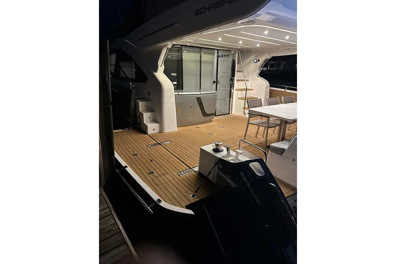 Slide: The Image of Luxurious 2023 Schaefer 660 yacht deck with elegant seating and modern design. - 16