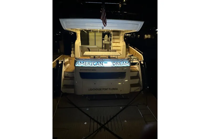 Slide: The Image of Schaefer 660 yacht named "American Dream" docked at night, Lighthouse Point, Florida. - 18