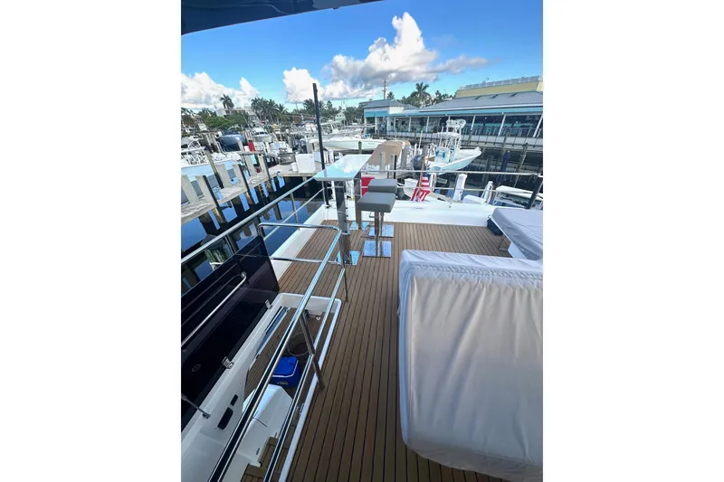 Slide: The Image of Deck view of 2023 Schaefer 660 yacht at marina, featuring sleek design and modern amenities. - 21