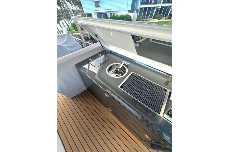Slide: The Image of Outdoor kitchen on 2023 Schaefer 660 yacht with grill and sink. - 22