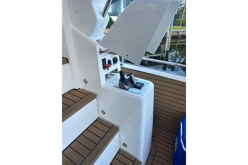 Slide: The Image of Control panel on Schaefer 660 yacht, 2023 model, with wooden deck steps. - 23
