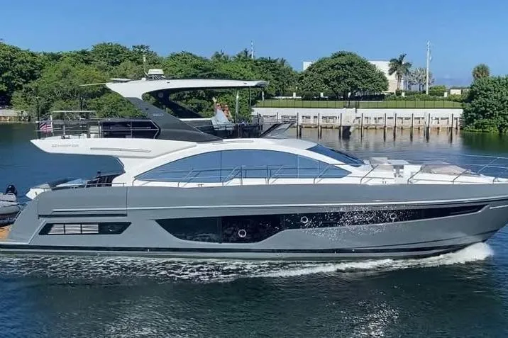 Slide: The Image of Luxury Schaefer 660 yacht cruising on a sunny day, 2023 model. - 3
