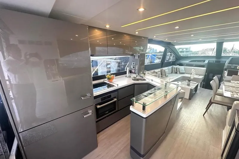 Slide: The Image of Luxurious interior of 2023 Schaefer 660 yacht with modern kitchen and seating area. - 6