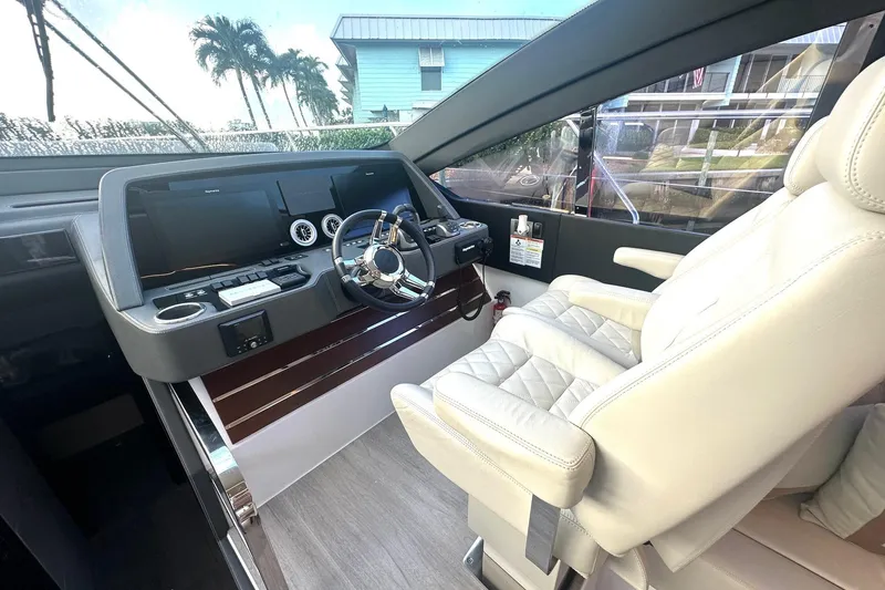 Slide: The Image of Luxurious 2023 Schaefer 660 yacht cockpit with modern controls and plush seating. - 9