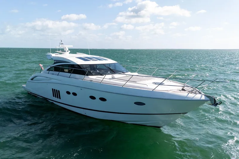 Slide: The Image of Luxurious 2009 Princess V62 yacht cruising on open sea under clear skies. - 28
