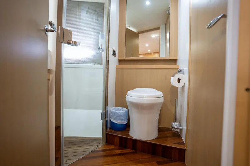 Slide: The Image of Luxurious bathroom in 2009 Princess V62 yacht with modern fixtures and wooden flooring. - 29