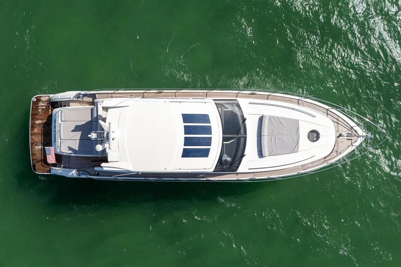 Slide: The Image of Aerial view of 2009 Princess V62 yacht on green water. - 31