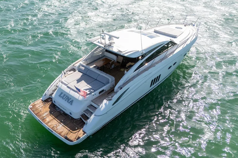 Slide: The Image of 2009 Princess V62 yacht "Luna" cruising on sparkling green water. - 32