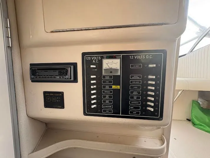 Slide: The Image of Electrical panel of 2002 Grady-White Marlin 300 boat, showing 120V AC and 12V DC systems. - 17