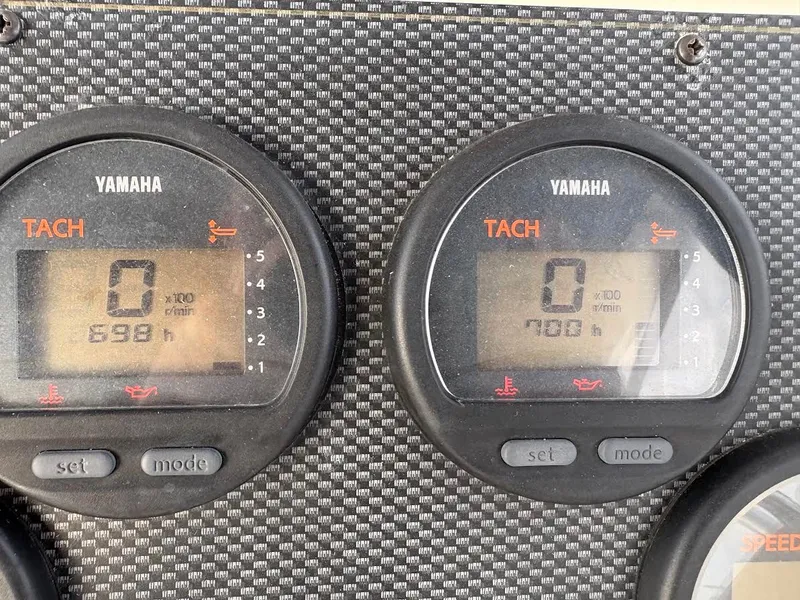 Slide: The Image of Yamaha tachometers on 2002 Grady-White Marlin 300 boat dashboard, showing engine hours. - 20