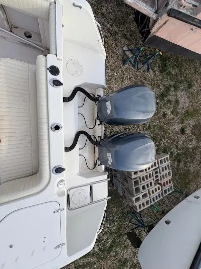 Slide: The Image of 2002 Grady-White Marlin 300 boat with dual outboard motors, viewed from above. - 22