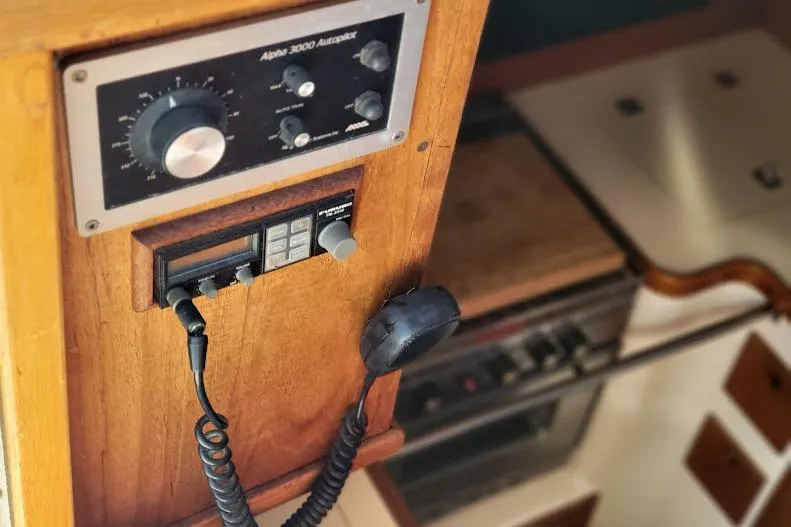 Slide: The Image of 1988 Freedom Yachts FREEDOM 36 yacht interior with Alpha 3000 Autopilot controls and VHF both accessible to the cockpit - 10