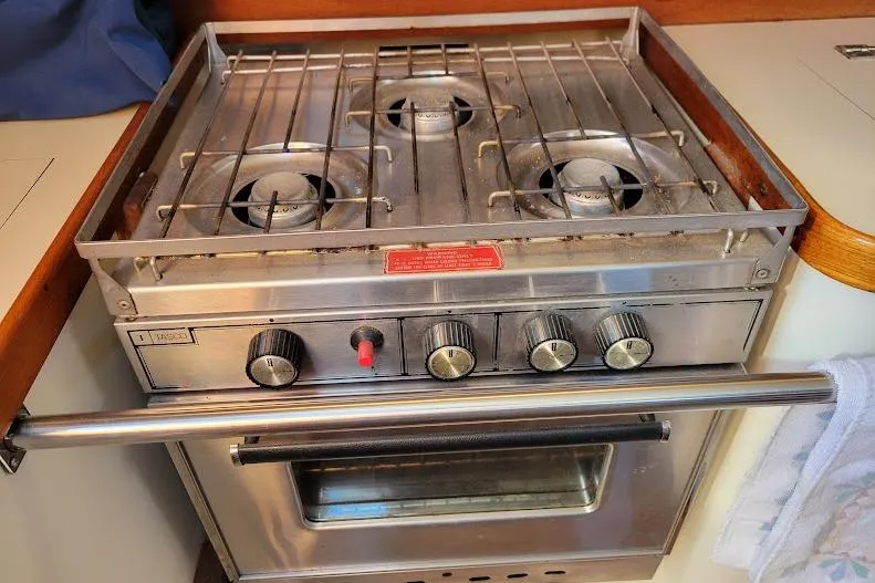 Slide: The Image of Stainless steel stove and oven in 1988 Freedom 36 yacht kitchen. - 15