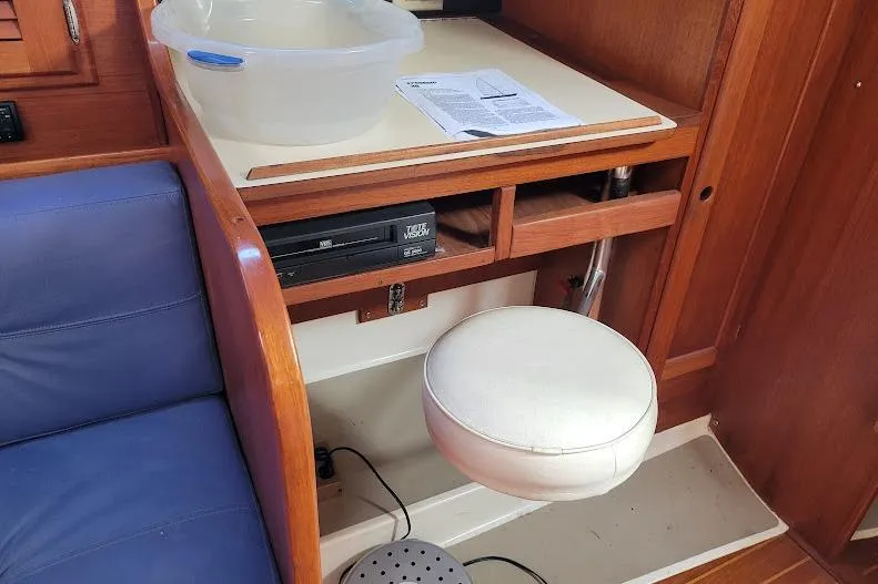 Slide: The Image of Interior of 1988 Freedom 36 yacht with seating, table, and storage. - 28